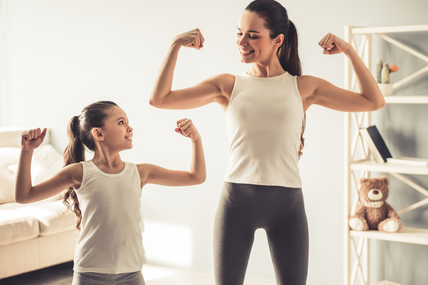 Mother and daughter reviewing health data on a tablet, showing growth charts and lab results